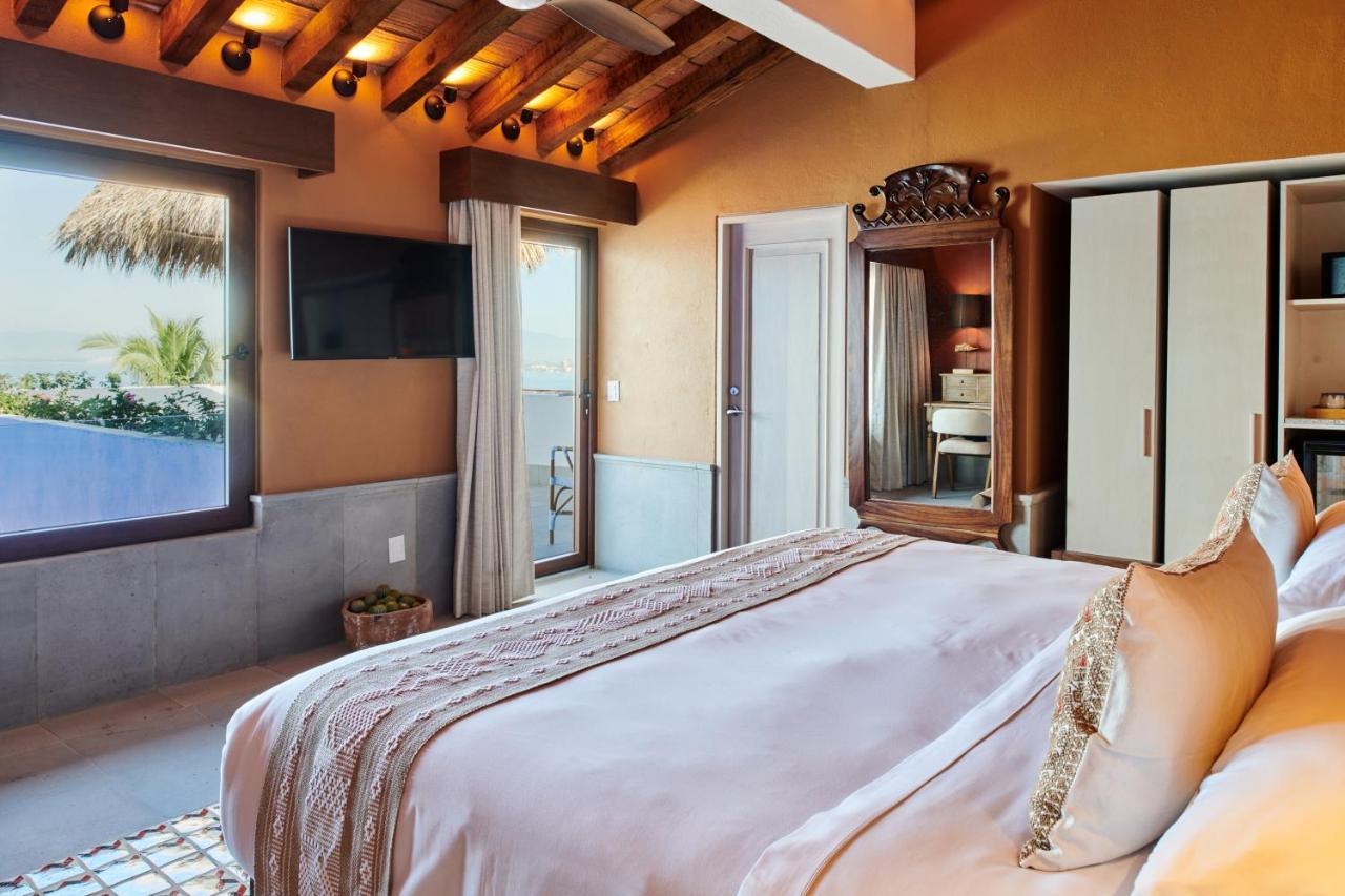 Hotel Luxury Patio Azul (Adults Only) ปูแอร์โตบาญาร์ตา ภายนอก รูปภาพ A bedroom at the hotel